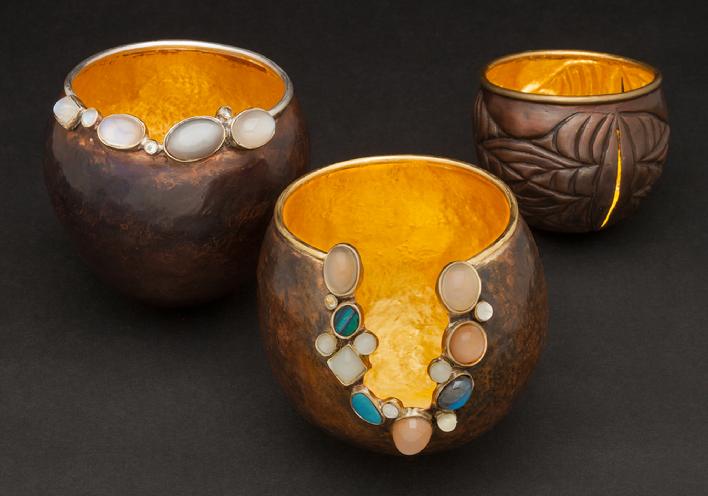 hadn raised copper vessel,24K gold,chasing and repousee, moonstones, gems. Call for pricing and availability
